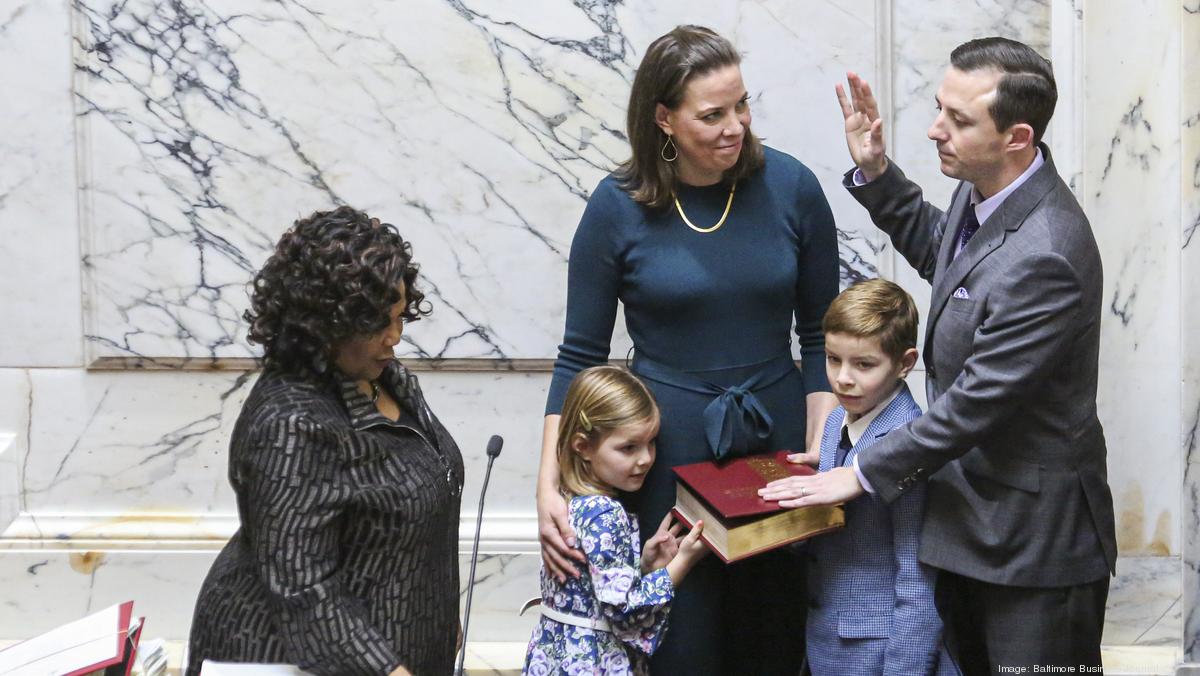 Senator Bill Ferguson is sworn in as Maryland State Senate President alongside his wife and children.
