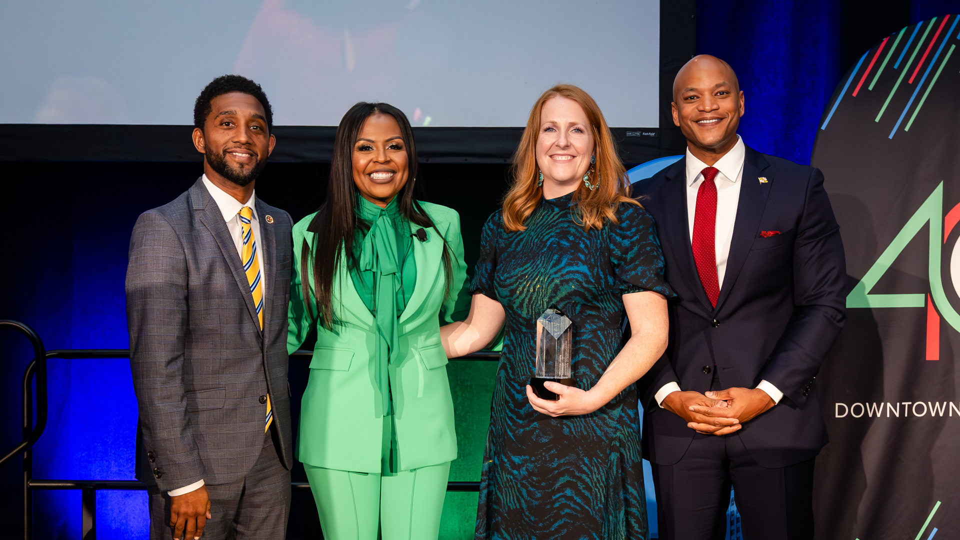 Mayor Brandon Scott, Shelonda Stokes, Governor Wes Moore and Jennifer Curry of Baker Donelson at Downtown Partnership of Baltimore's Annual Meeting 2023.
