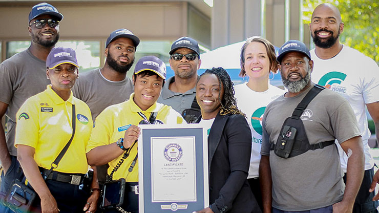 Downtown Partnership's homeless outreach team holding an award.